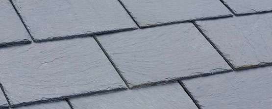 Closeup Of Traditional Grey Slate Roof Tiles On A Pitched Roof