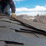 roofer performing storm damage repair